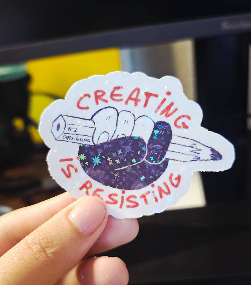 "creating is resisting" holo vinyl sticker (2026)